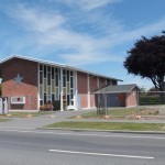 a bare site, where the church hall next to be, while the church still stands but fenced off